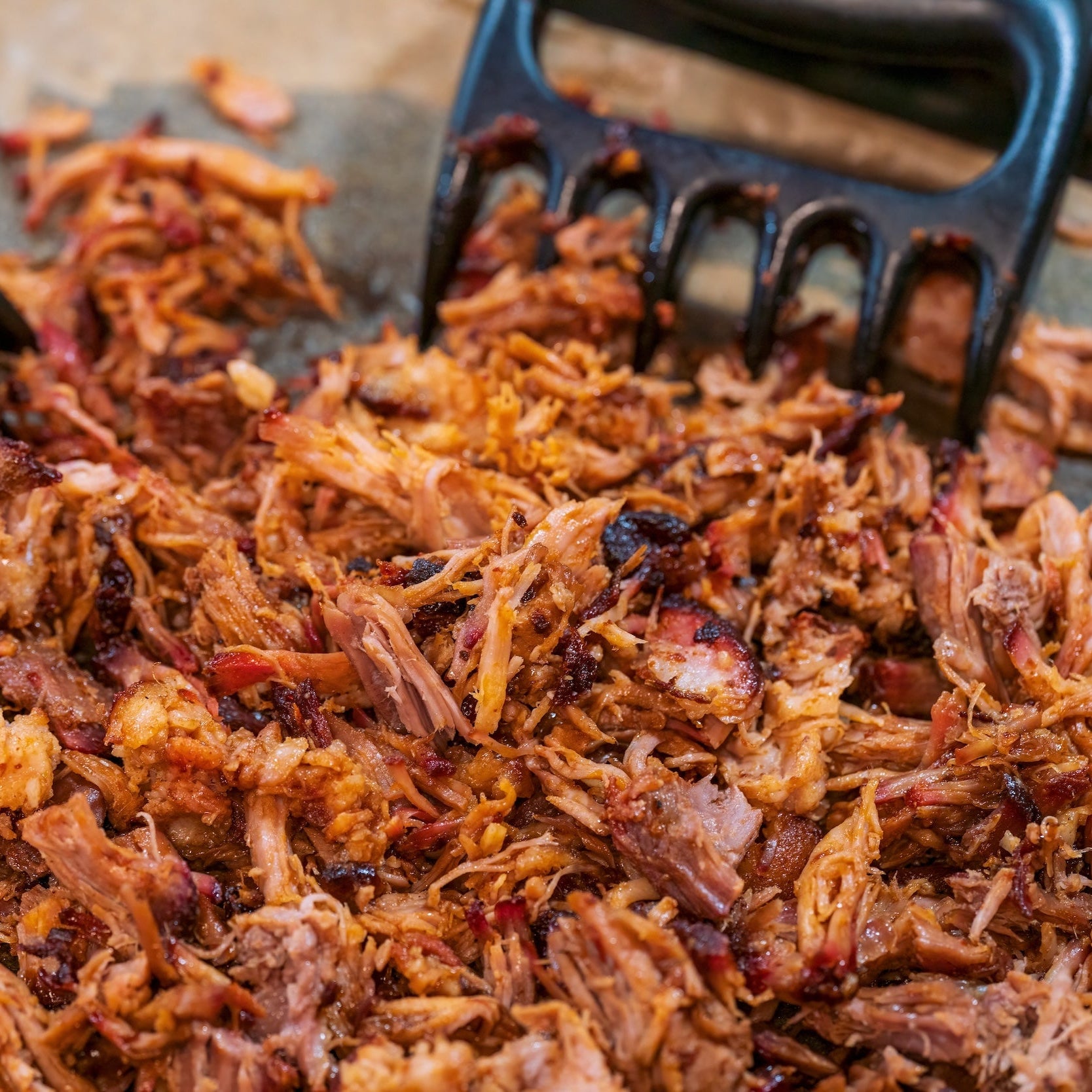 shredded pork in a cast iron